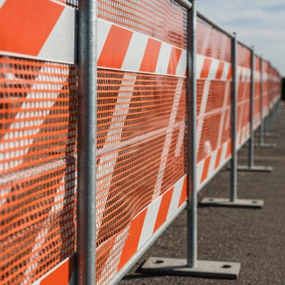 Temporary fencing at a construction site with clear compliance markings