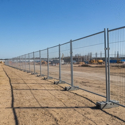Robust temporary fencing solution standing strong against strong winds in an open field, no text, no words, no typography, 8K, natural lighting
